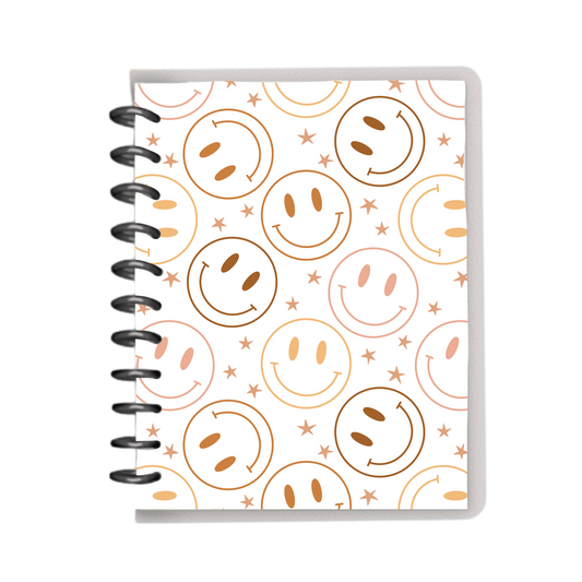 Warm colored smileys on white cover notebook